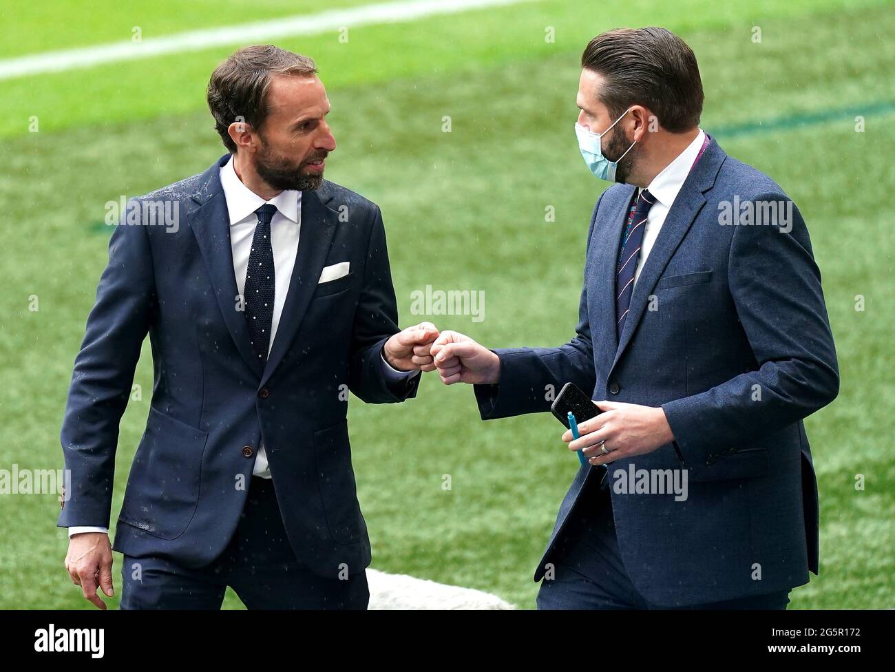England manager Gareth Southgate (left) and press officer Andy Walker before the UEFA Euro 2020 round of 16 match at Wembley Stadium, London. Picture date: Tuesday June 29, 2021. Stock Photo