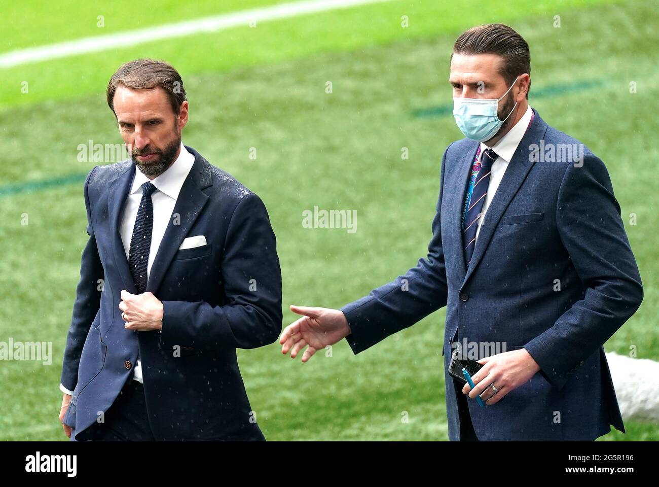 England manager Gareth Southgate (left) and press officer Andy Walker before the UEFA Euro 2020 round of 16 match at Wembley Stadium, London. Picture date: Tuesday June 29, 2021. Stock Photo