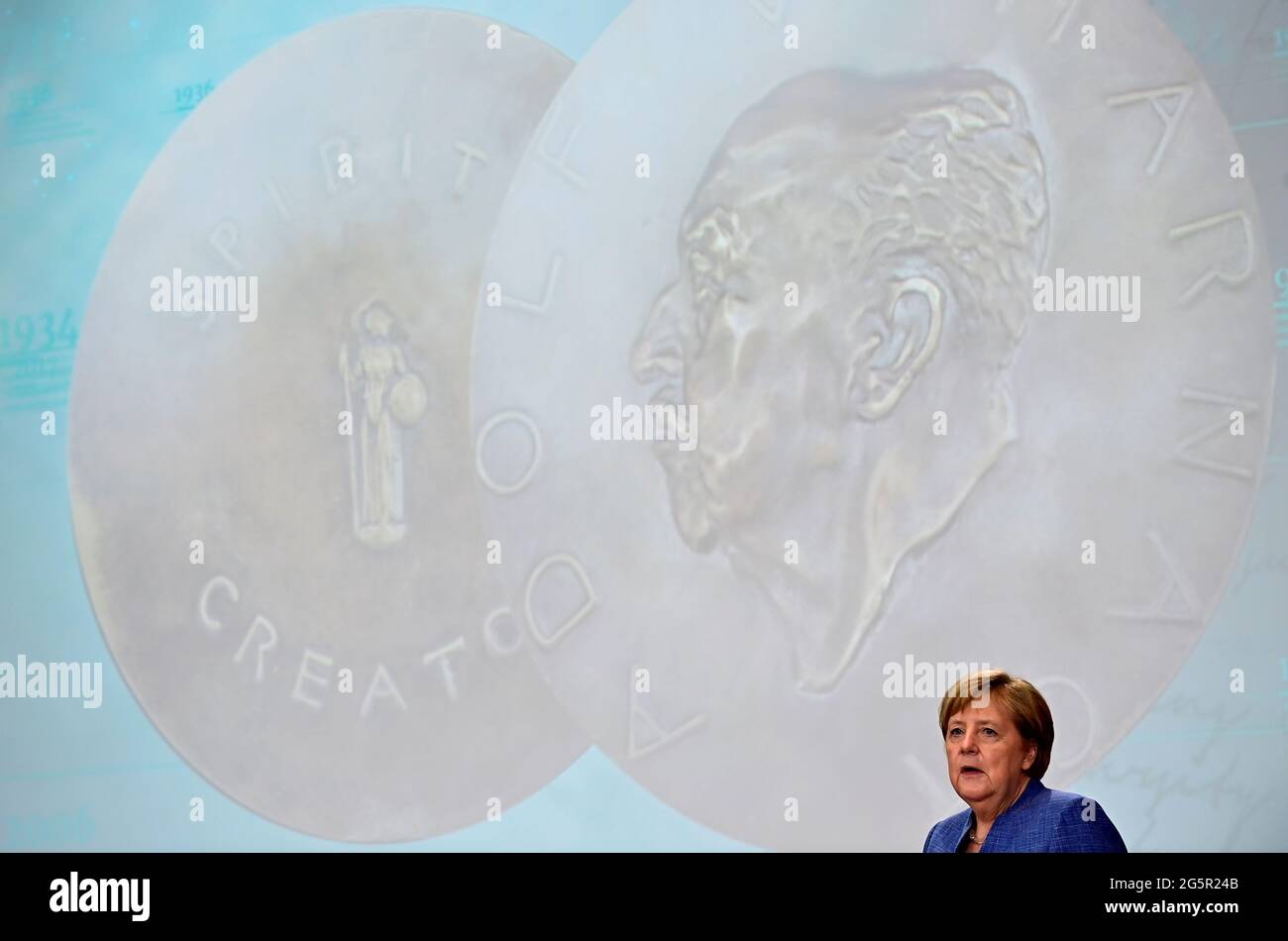 German Chancellor Angela Merkel delivers a speech after having been awarded with Harnack Medal, the highest award presented by the Max Planck Society for services to society, at Humboldt Carre in Berlin, Germany June 29, 2021. Tobias Schwarz/Pool via REUTERS Stock Photo
