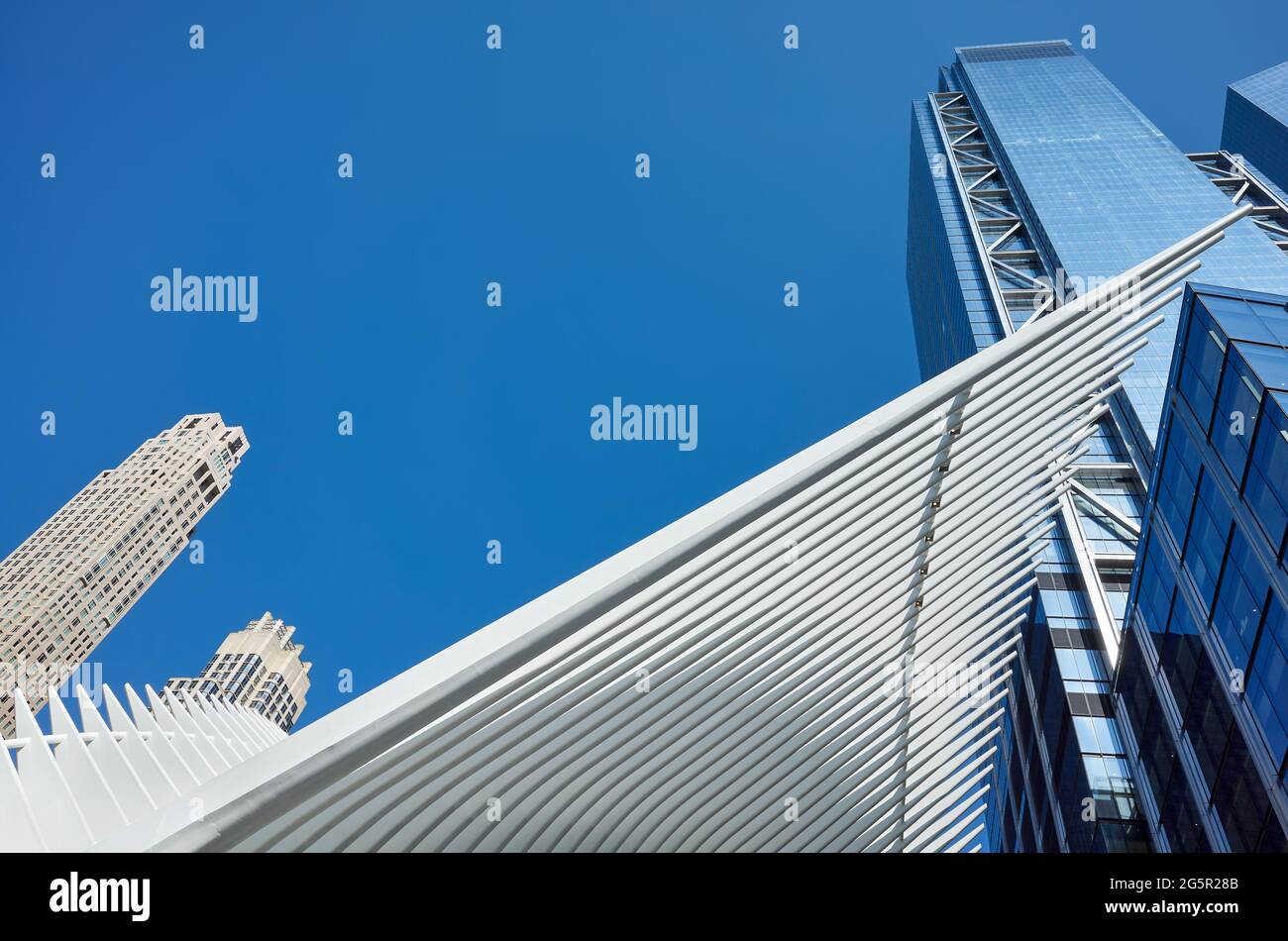 New York, USA - July 05, 2018: Looking up at World Trade Center complex with Oculus ribs (WTC Transportation Hub) against the blue sky. Stock Photo