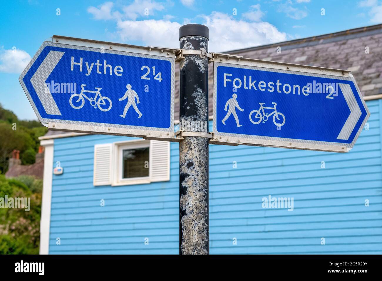 Road Sign pointing towards Hythe and Folkestone, taken at Sandgate Stock Photo