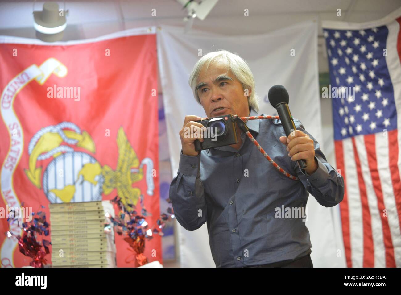 June 26, 2021, Falmouth, Massachusetts, U.S: Nick Ut reenacts how he photographed children injured by napalm in 1972 that became one of the iconic photos that help to end the war. Vietnam veterans met to support the American Documentaries new project, ''Every Time The Wind Blew'', interviews with a spectrum of military and civilians who experience the Vietnam War including soldiers, nurses, photojournalists, K9S and handlers, South Vietnamese Children and more. The organization believes in humanizing war so we negotiate more and fight less by separating the warrior from the war. The project is Stock Photo