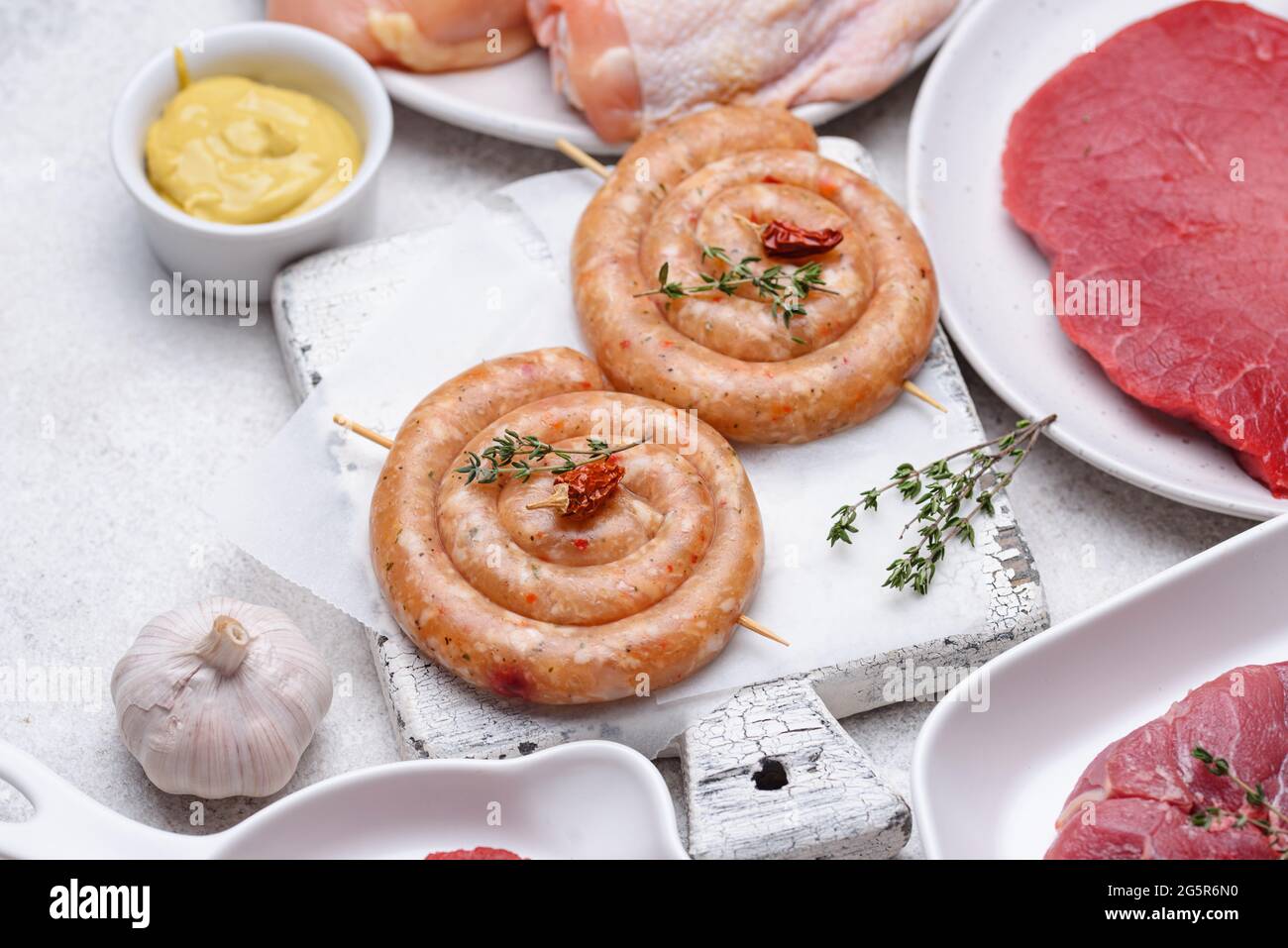 Raw uncooked chicken sausages with spices Stock Photo Alamy