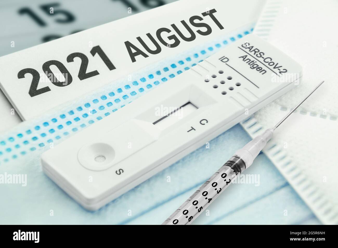 Calendar August 2021 Corona Rapid Test and Masks with Vaccination Stock Photo