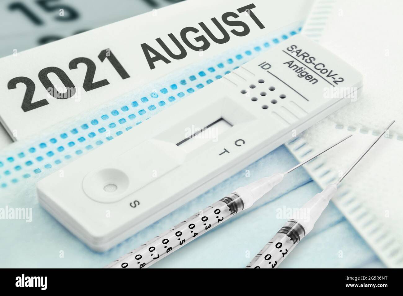 Calendar August 2021 Corona Rapid Test and Masks with Vaccination Stock Photo