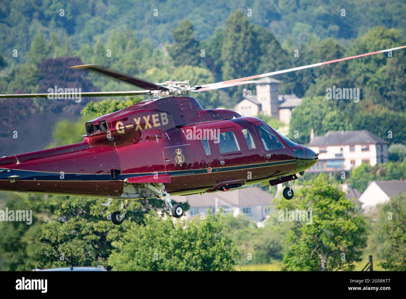 Stirling, Scotland, UK. 29th June, 2021. PICTURED: Her Majesty The Queen Elizabeth II flies in on her private Sikorsky helicopter (registered: XXEB) on the hottest day this year landing at Stirling Rugby ground, on route to Stirling Castle for the reopening of The Argyle and Sutherland Highlander's Museum at Stirling Castle. The Royal standard was flying whilst she was at the castle. Credit: Colin Fisher/Alamy Live News Stock Photo