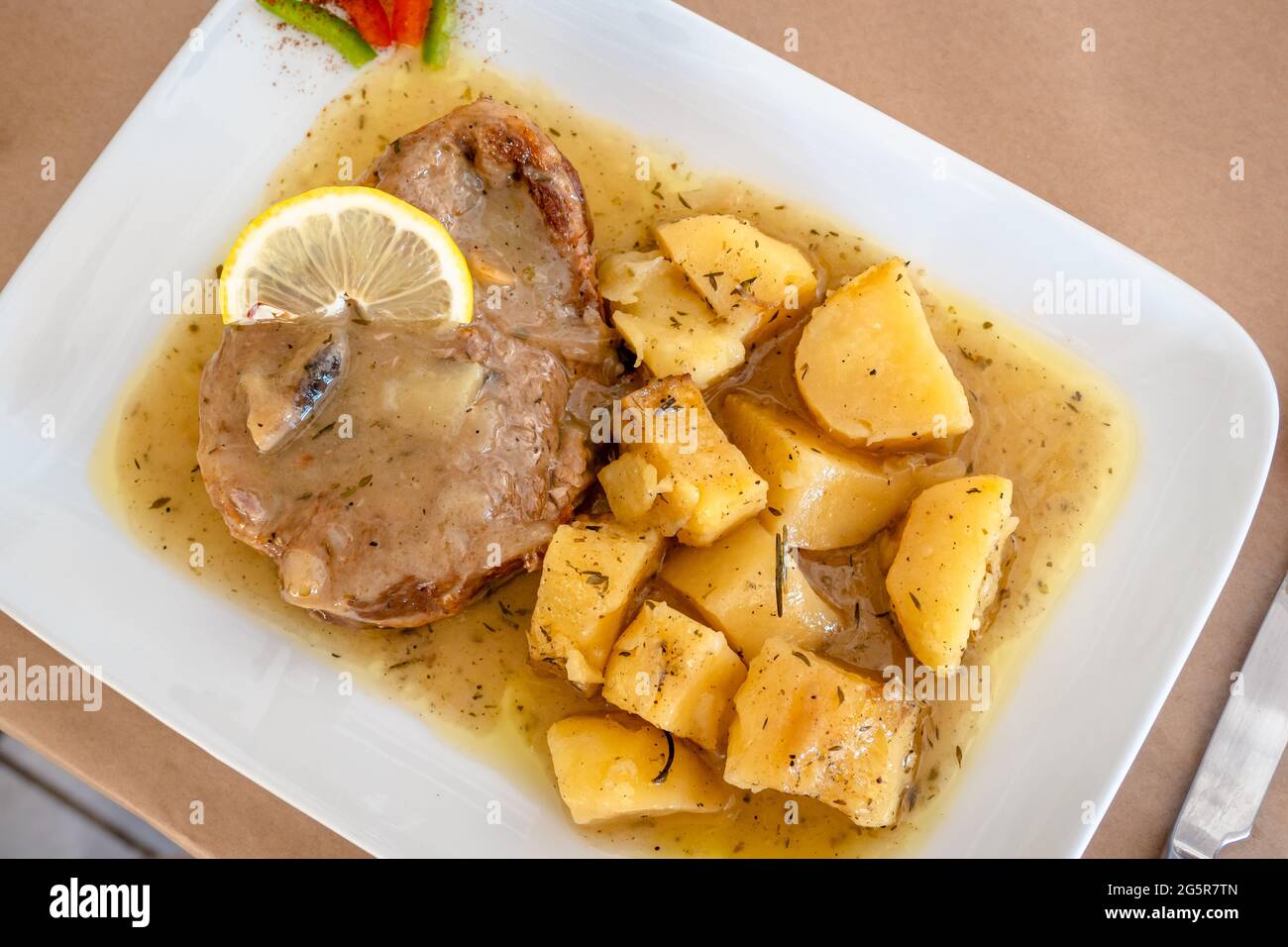 Braised lamb in gravy served with potatoes at the restaurant