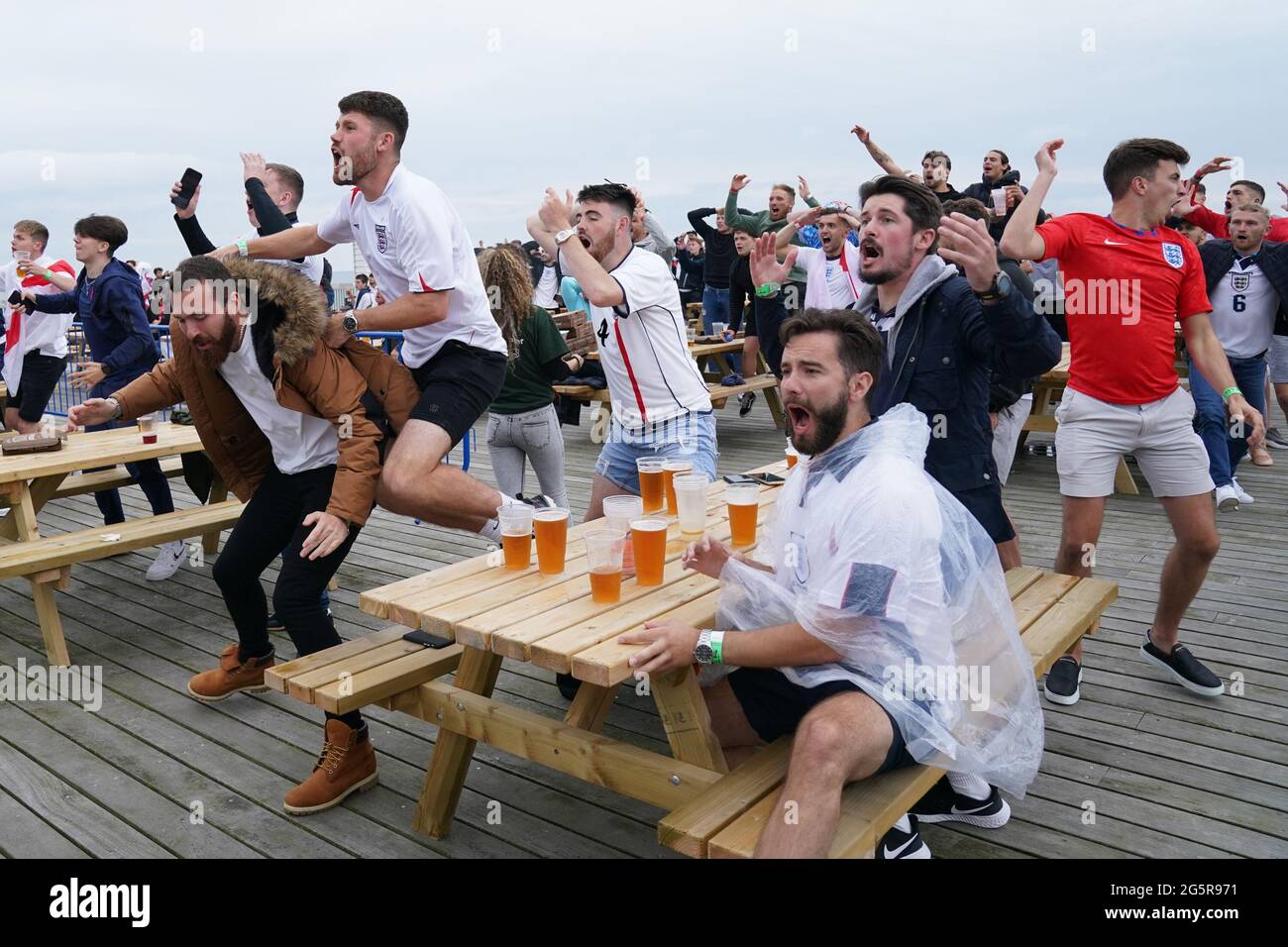 Fans react to a near-miss as they watch the UEFA Euro 2020 round of 16 match between England and Germany at the 4TheFans fan park at Hastings Pier in Hastings. Picture date: Tuesday June 29, 2021. Stock Photo