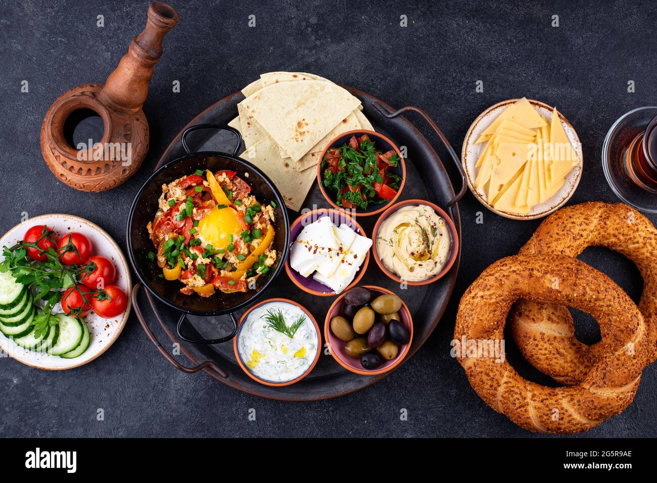 Traditional Turkish breakfast with meze and simit Stock Photo