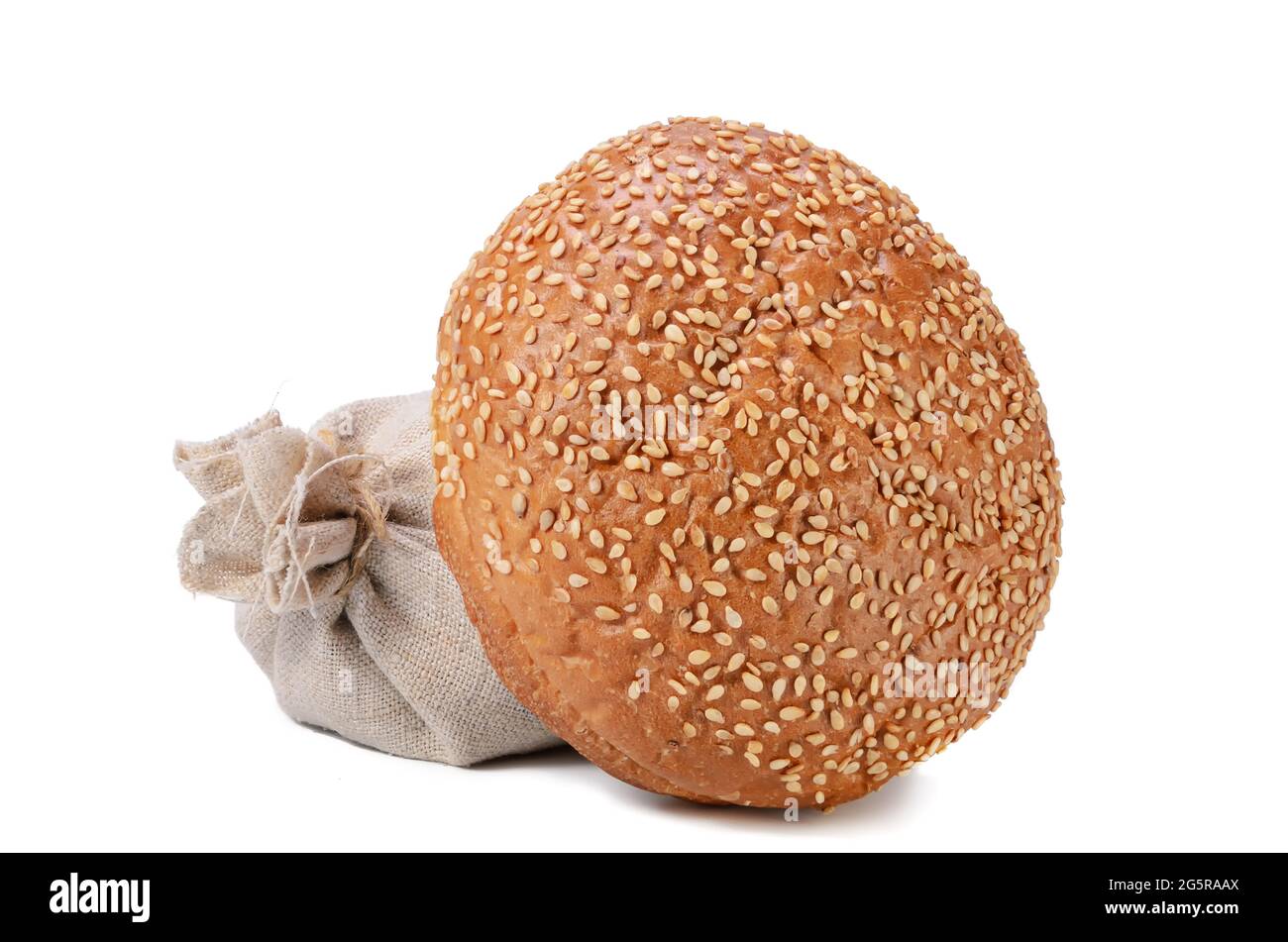 fresh bun, sprinkled with sesame seeds on a white background with soft shadow Stock Photo