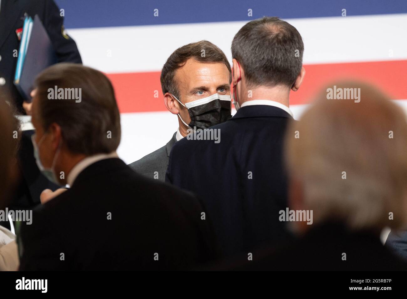 Paris France, on June 29, 2021. French President Emmanuel Macron talks with French Health Minister Olivier Veran after his speec during the launching of the French Strategic Council for the Healthcare Industries (CSIS) meeting at the Elysee Palace in Paris, France on June 29, 2021. Photo by Jacques Witt/Pool/ABACAPRESS.COM Stock Photo