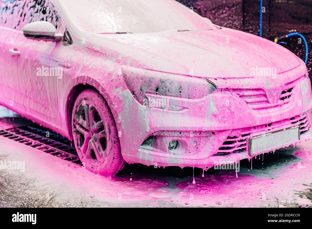 Car washing concept. Red car in foam Stock Photo - Alamy