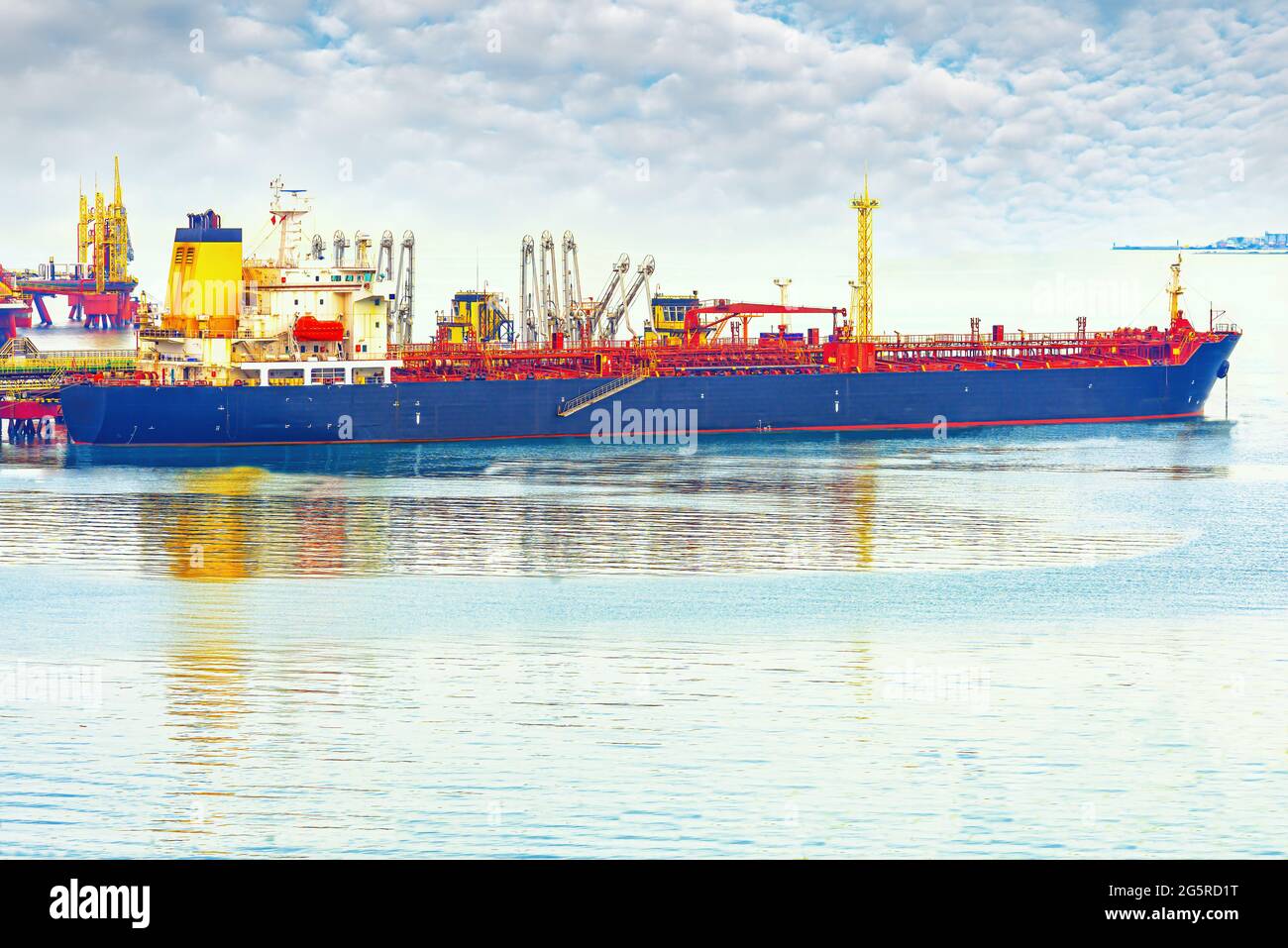 An oil tanker in the Novorossiysk port is loaded with crude oil Stock Photo