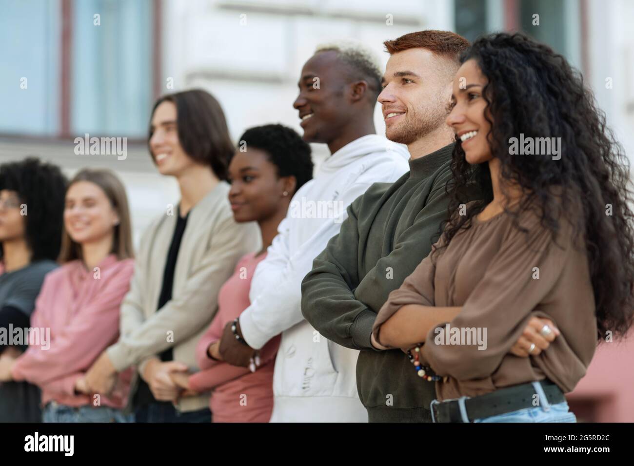 International group of cheerful students holding hands Stock Photo - Alamy