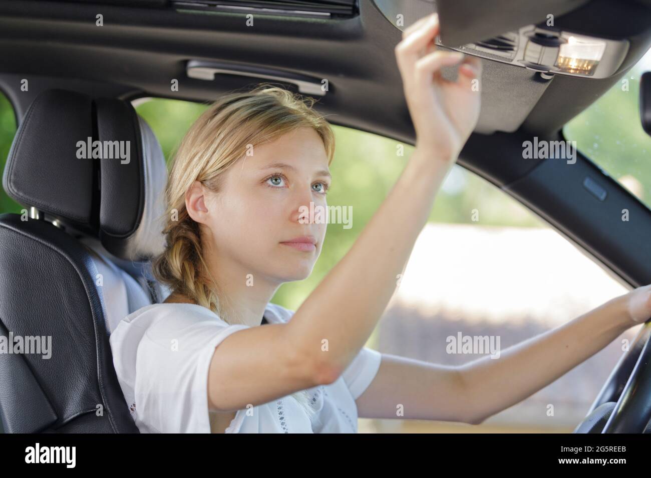 Adjusting the rear view mirror of a car hi-res stock photography and ...