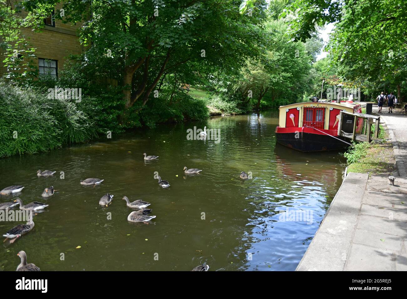 Canal boat and tourists, the canal, Saltaire, Shipley, West Yorkshire Stock Photo
