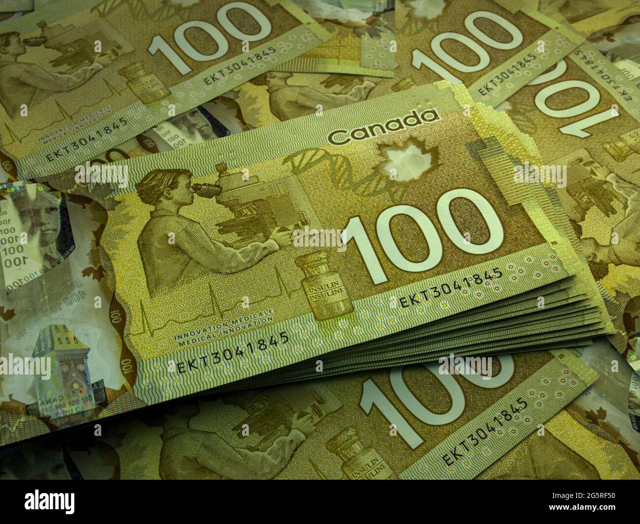 Money of Canada. Canadian dollar bills. CAD banknotes. 100 dollars.  Business, finance, news background Stock Photo - Alamy