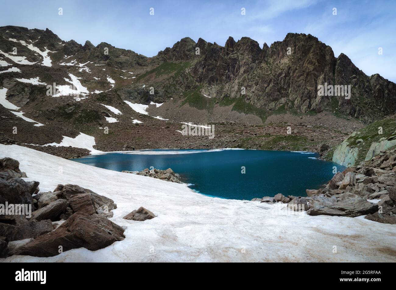 Mountain lake of Laroussa, in Stura Valley, Piedmont, between maritime alps park (italy) and mercantour park (france). The blue water is surrounded by Stock Photo