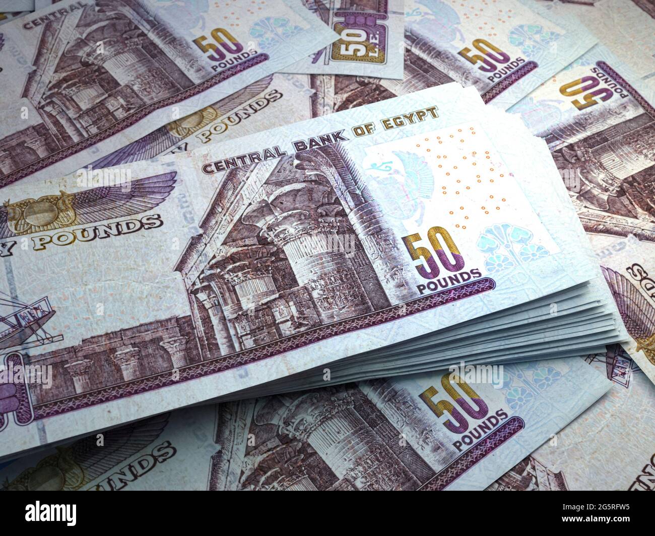money-of-egypt-egyptian-pound-bills-egp-banknotes-50-pounds-business-finance-news-background-2G5RFW5.jpg