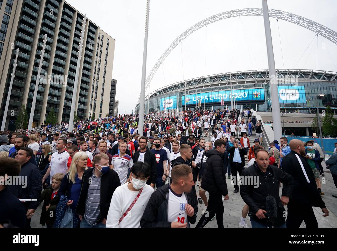 Fans leave Wembley stadium following the UEFA Euro 2020 round of 16 match between England and Germany at the 4TheFans fan zone outside Wembley Stadium. Picture date: Tuesday June 29, 2021. Stock Photo