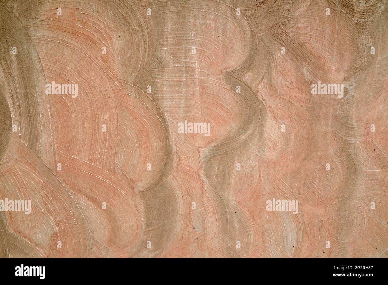 Abstract, multi-colored swirled stucco, or plaster, wall background. Stock Photo