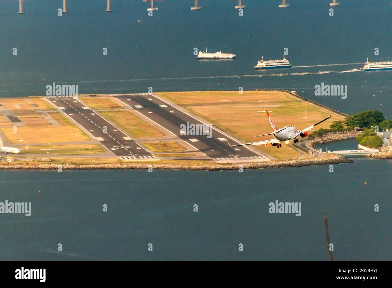 RIO DE JANEIRO, BRAZIL - JANUARY 28, 2015: Airplane of GOL airlines lands at Santos Dumont Airport in Rio de Janeiro, Brazil Stock Photo