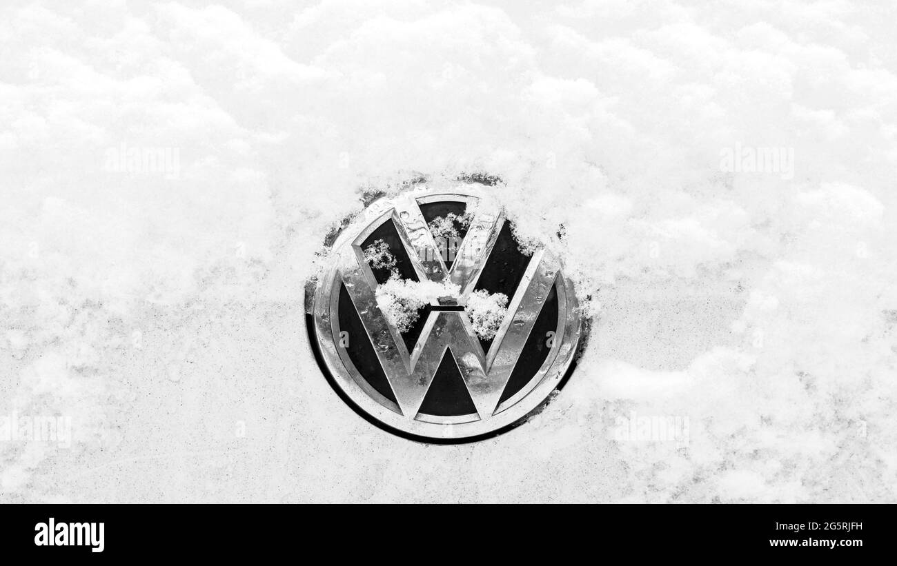 Close-up of A Snow-capped VW Logo On A Car Stock Photo