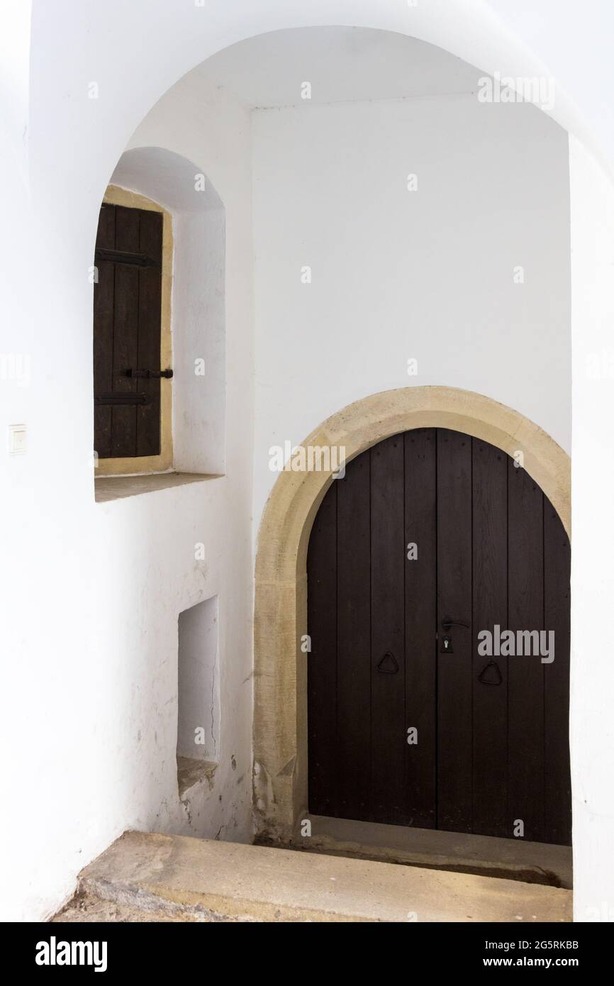 Stone frame door in arched passageway of Medieval house, Sopron