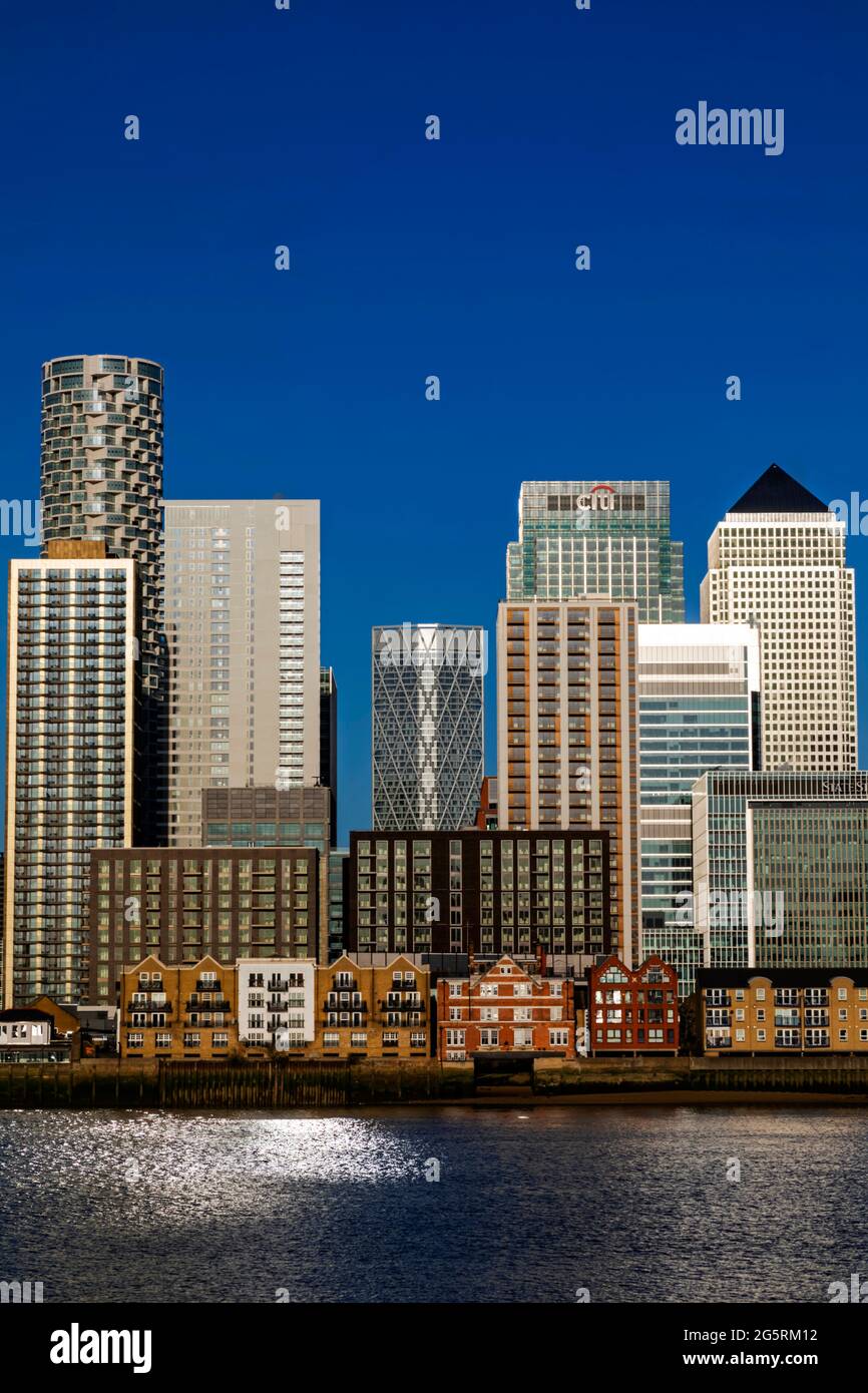 England, London, Docklands, River Thames and Warm Early Morning Light on The Modern Canary Wharf Skyline Stock Photo