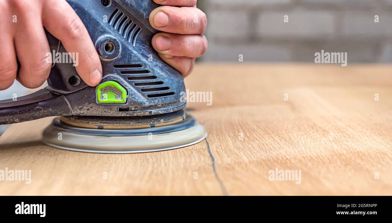 A carpenter works in a Joiner's grinders, furniture