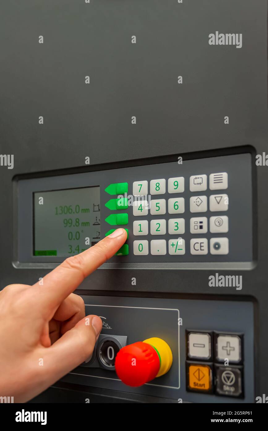 The process of programming a CNC machine. Entering data into a computer