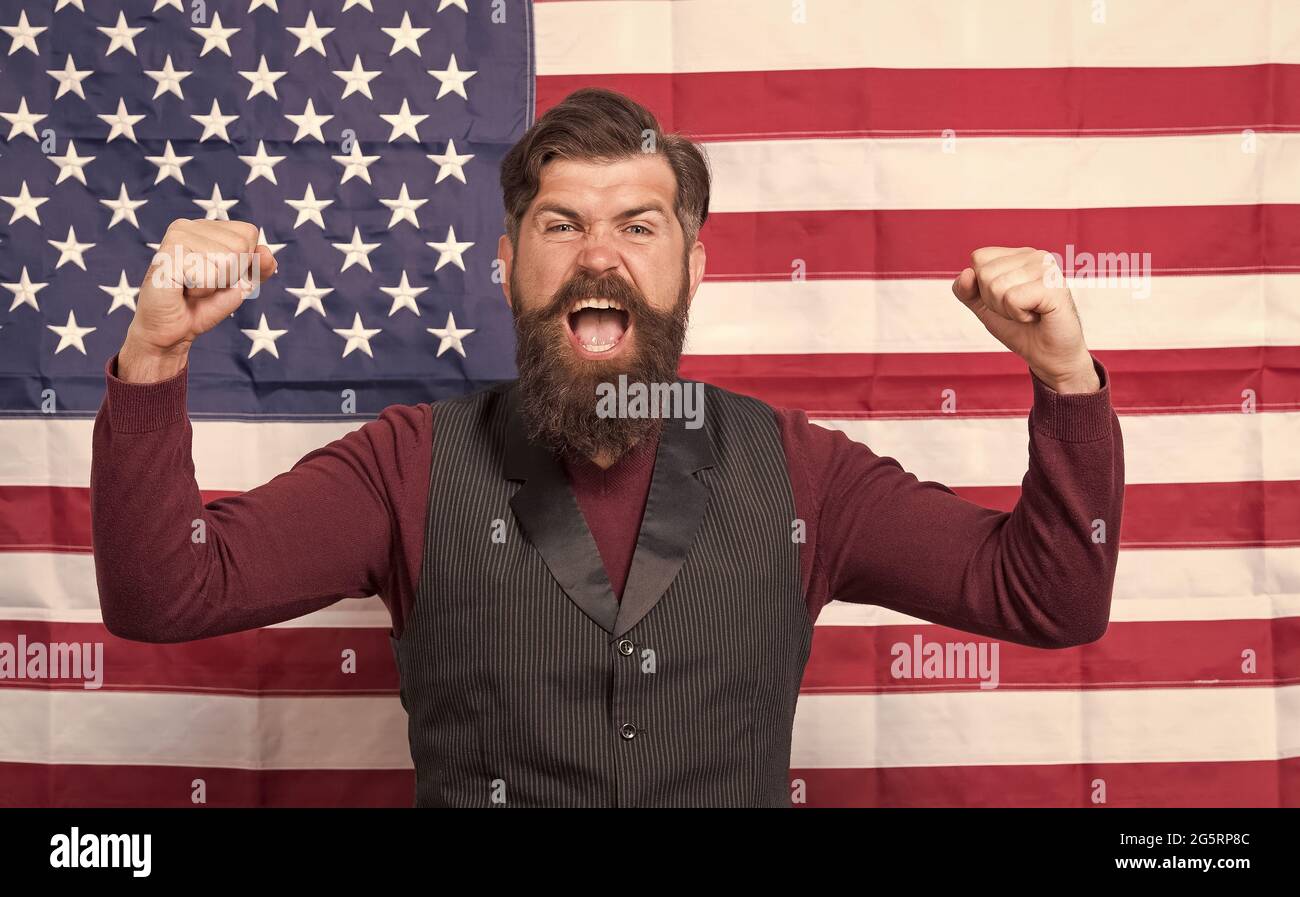 Promoting american values. Confident businessman american flag