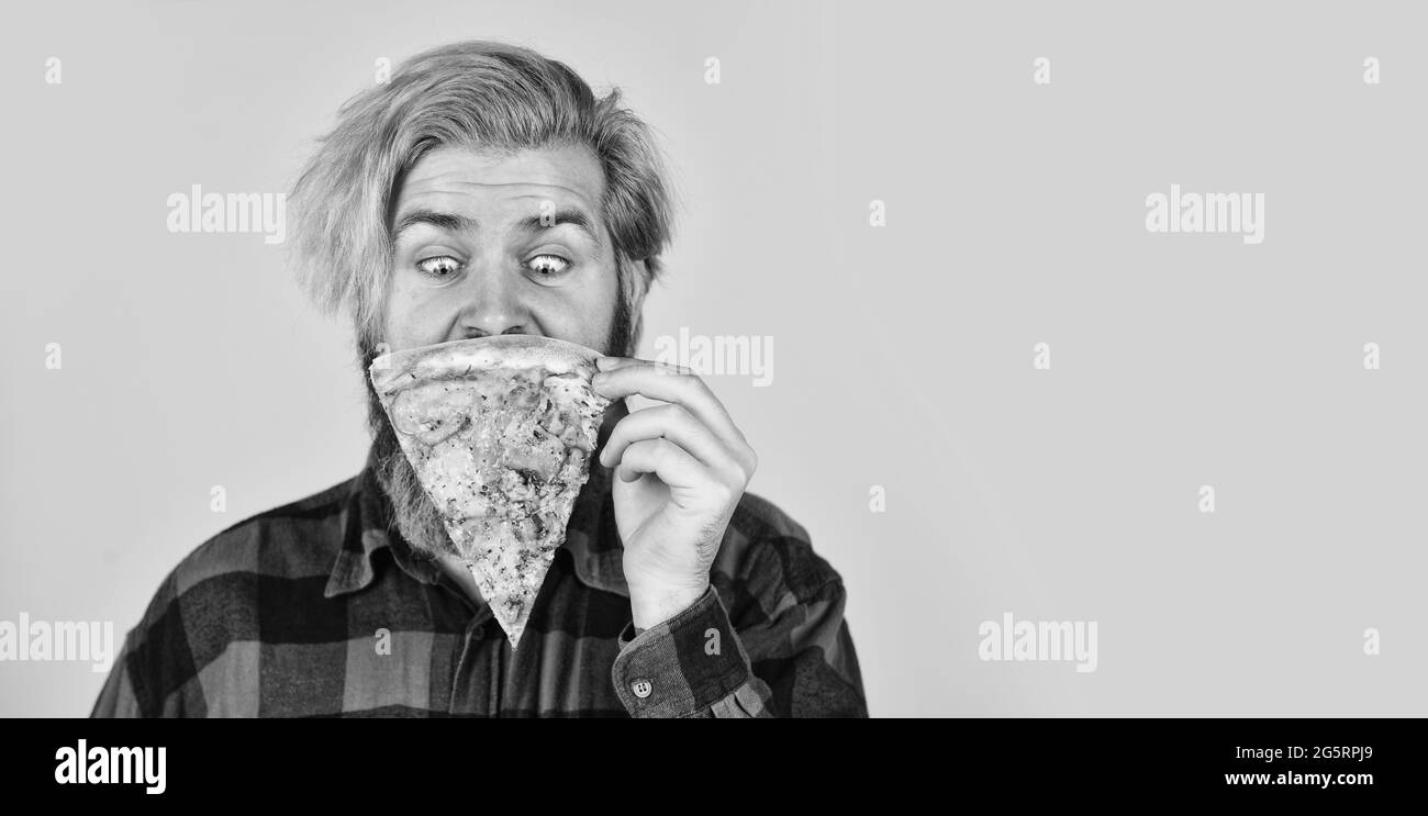 Good to last slice. Hungry man going to eat pizza alone. Cheesy taste. In mood for Italian food. Man bearded hipster hold pizza. Pizza delivery Stock Photo