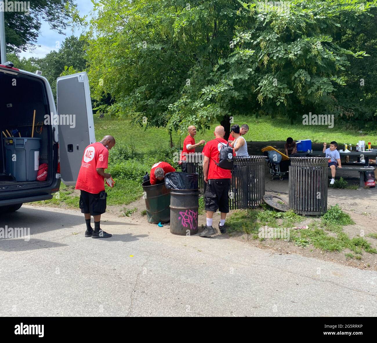 Association for Community Employment: ACE empowers New Yorkers experiencing homelessness through a comprehensive vocational rehabilitation and workforce development program. Homeless ACE members cleaning in Prospect Park in Brooklyn, NY. Stock Photo