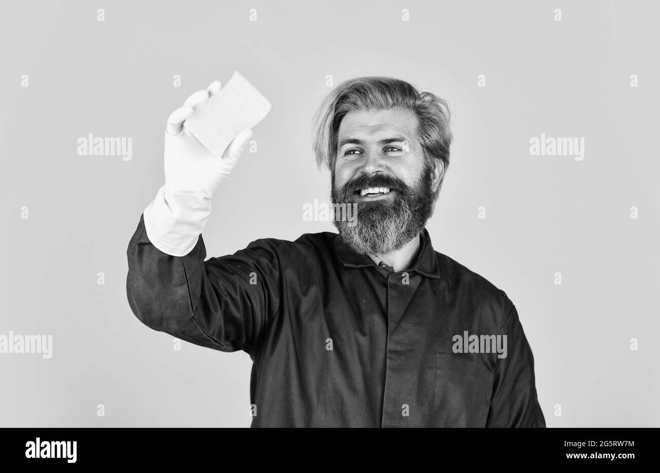 spring cleaning service. using sponge for cleaning. Husband clean house. hygiene and purity. bearded man wear rubber gloves. mature janitor in uniform Stock Photo