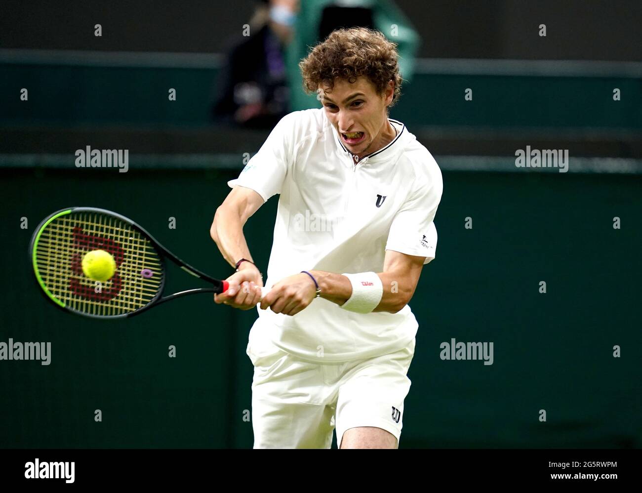 Ugo Humbert in action during his first round gentlemen's singles match against Nick Kyrgios on court 1 on day two of Wimbledon at The All England Lawn Tennis and Croquet Club, Wimbledon. Picture date: Tuesday June 29, 2021. Stock Photo
