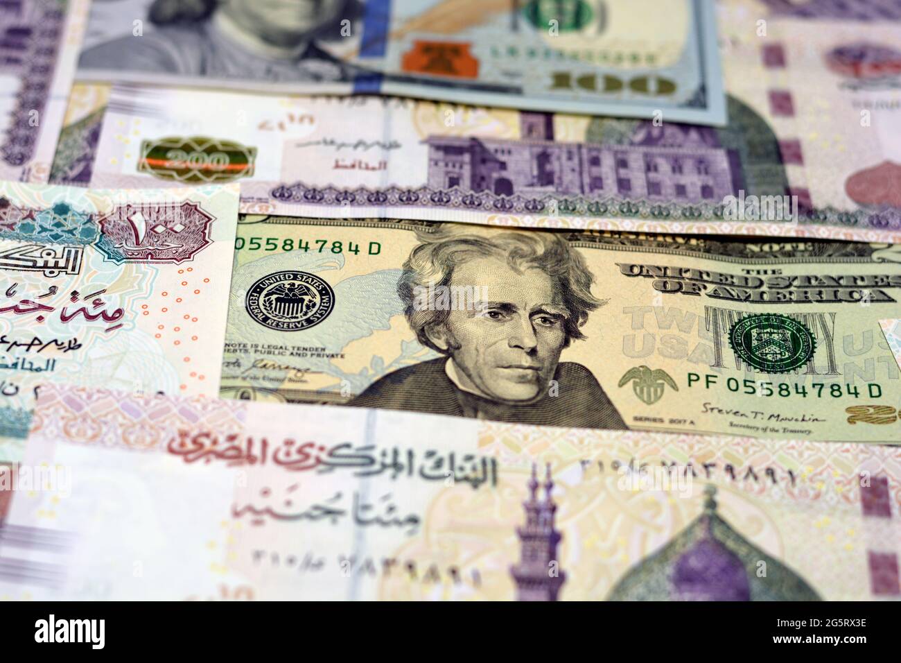 Egypt national currency with USA dollar banknote backdrop. Money