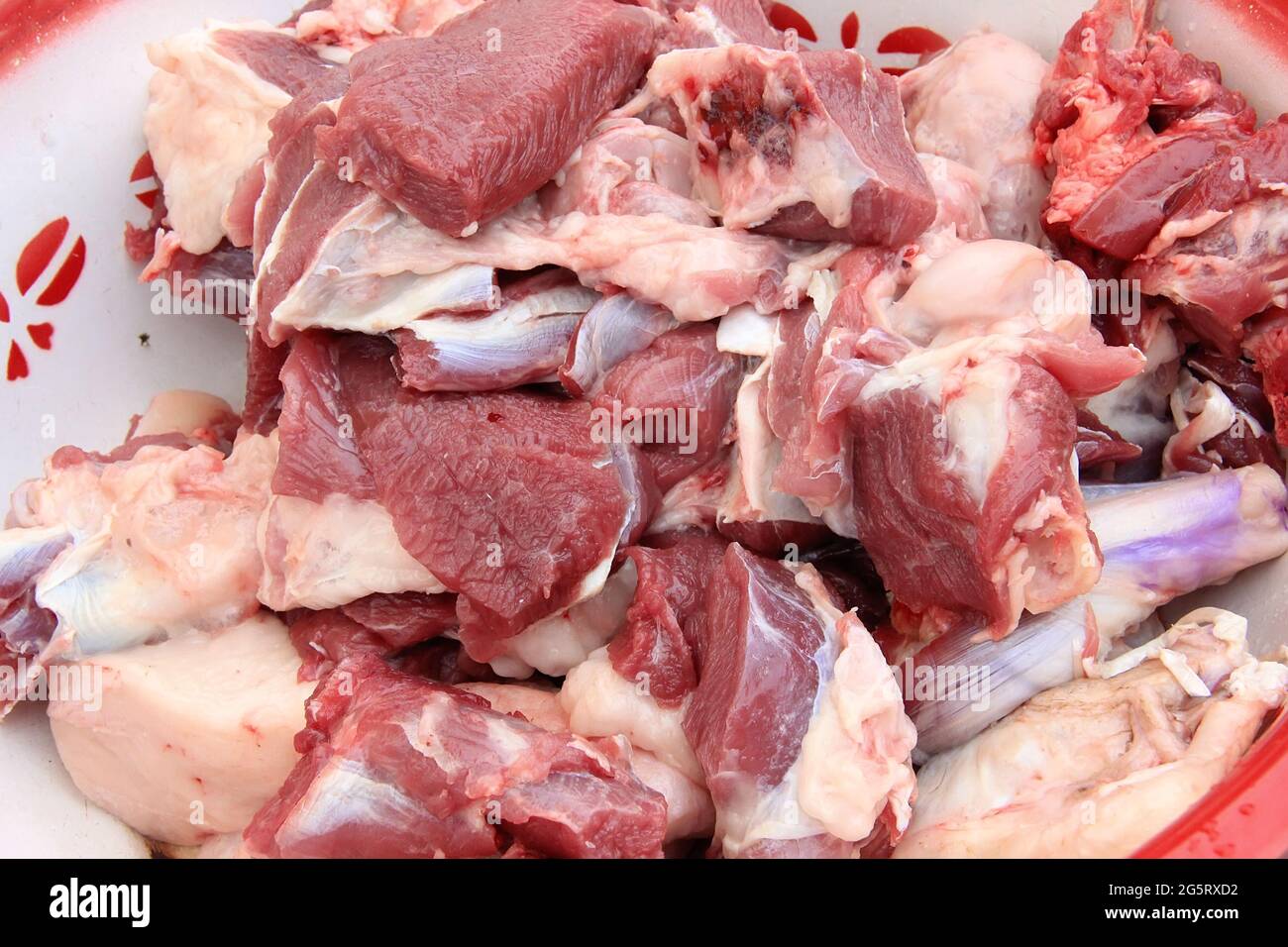 Raw lamb meat cut into large pieces and lamb fat in a cup, close-up Stock  Photo - Alamy