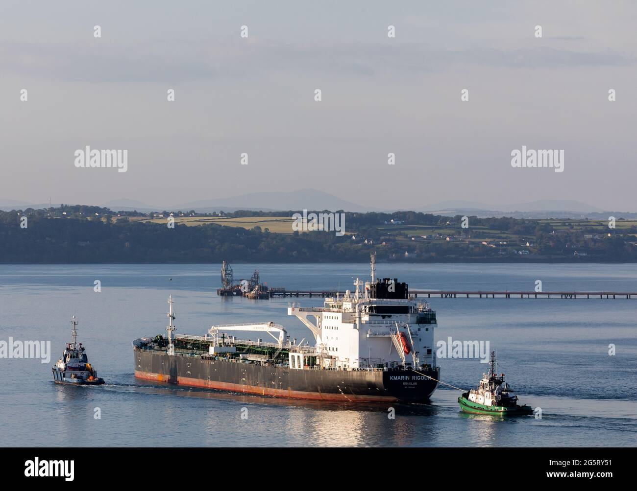 Cork Harbour, Cork, Ireland. 29th June, 2021. Oil tanker Kmarin Rigour steams through Cork Harbour escorted by tugs Ocean Challanger and DSG Titan after a voyage from Corpus Christi Texas with a supply of crude for the refinery at Whitegate, Co. Cork, Ireland. - Picture; David Creedon / Alamy Live News Stock Photo
