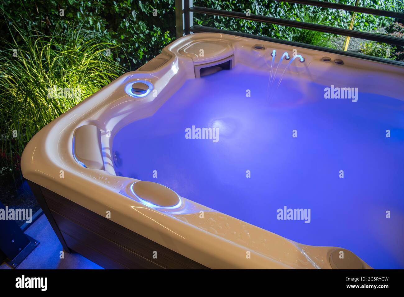 Cool Blue LED Illuminated and Running Home Garden Hot Tub Spa Inside Jacuzzi  Gazebos Stock Photo - Alamy