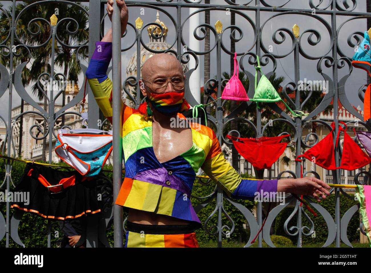 Bangkok, Thailand. 29th June, 2021. A sex worker activist from the Empower  Foundation poses in front of bikinis at the Government House gate during a  protest in Bangkok.Thai sex worker organization Empower