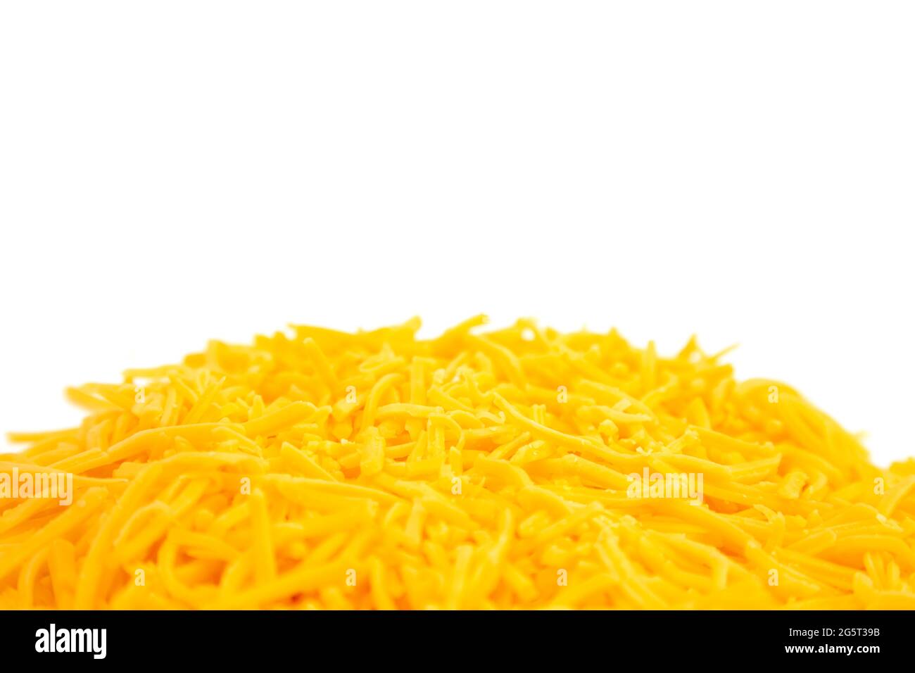 Grated Cheddar Cheese on a White Background Stock Photo