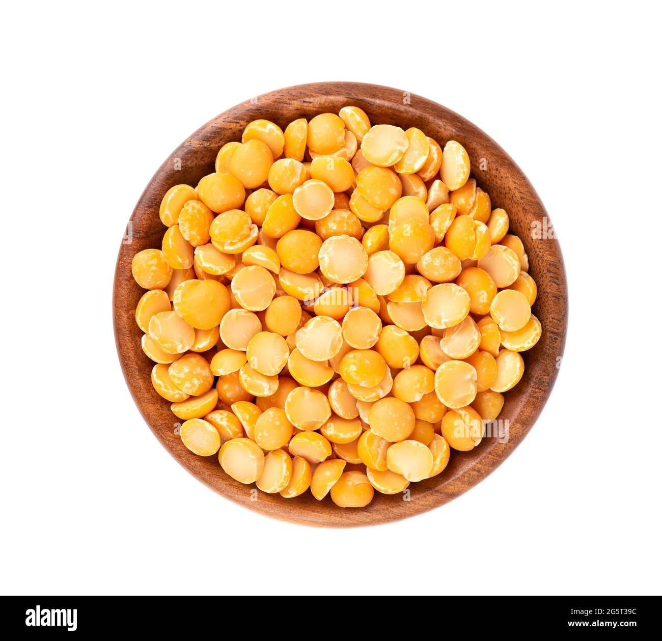 Dry yellow split peas in wooden bowl, isolated on white background