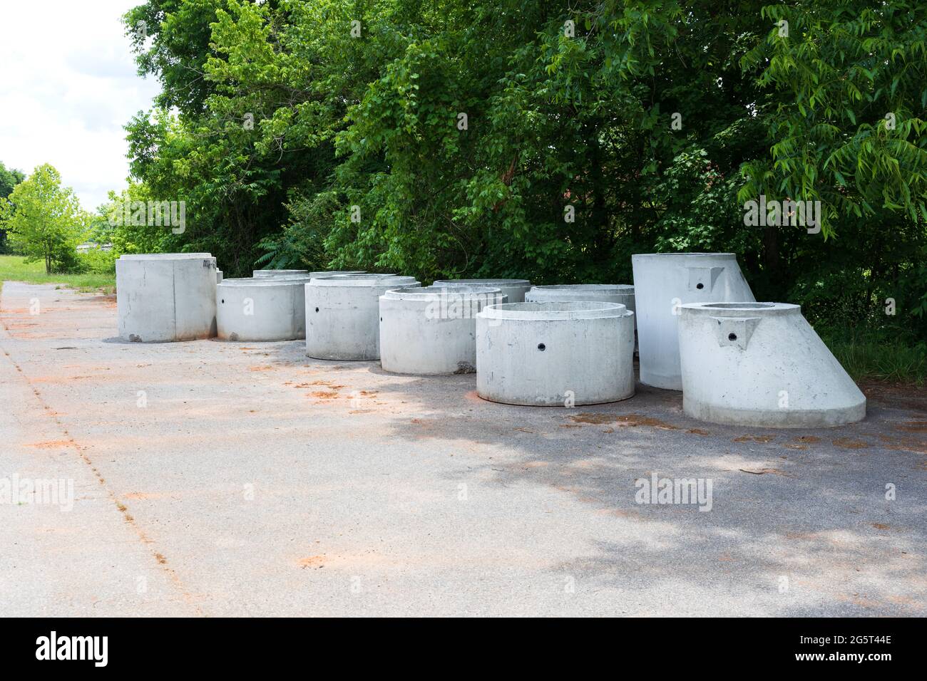 ELKIN, NC, USA-6 JUNE 2021:  A collection of concrete precast manholes waiting for use. Stock Photo