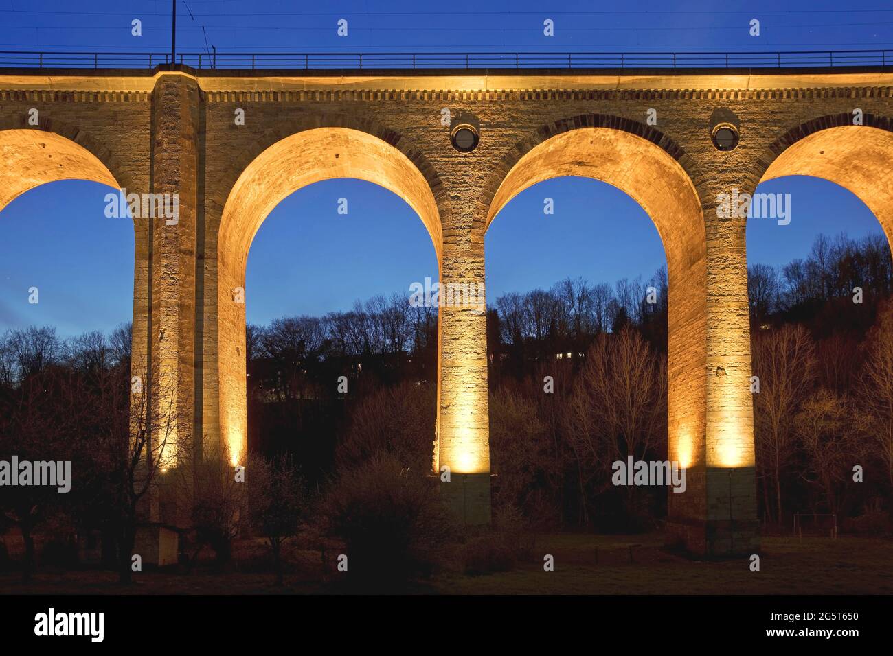 illuminated Altenbeken Viaduct in the evening, largest sand-lime stone bridge in Europe , Germany, North Rhine-Westphalia, East Westphalia, Stock Photo