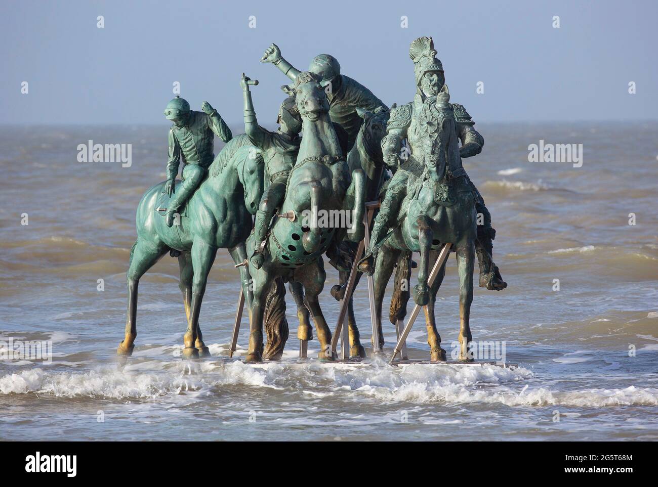 Artwork Men in the sea, Belgium, West Flanders, Nieuwpoort Stock Photo