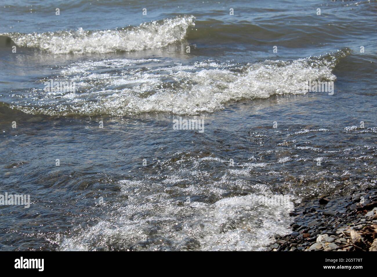 Waves one the shore of Keuka lake Stock Photo