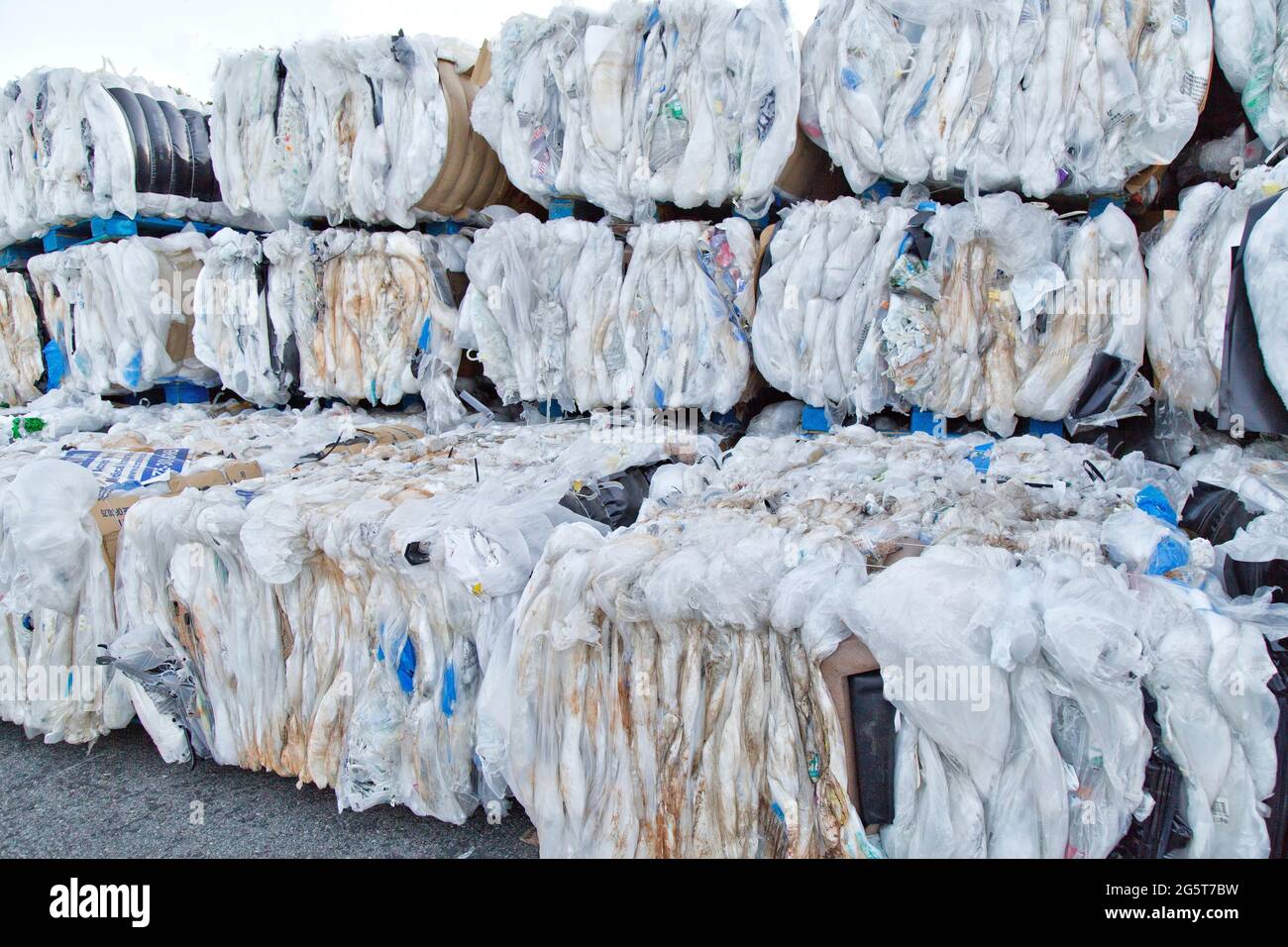Compacted, baled plastics to be recycled. Stock Photo