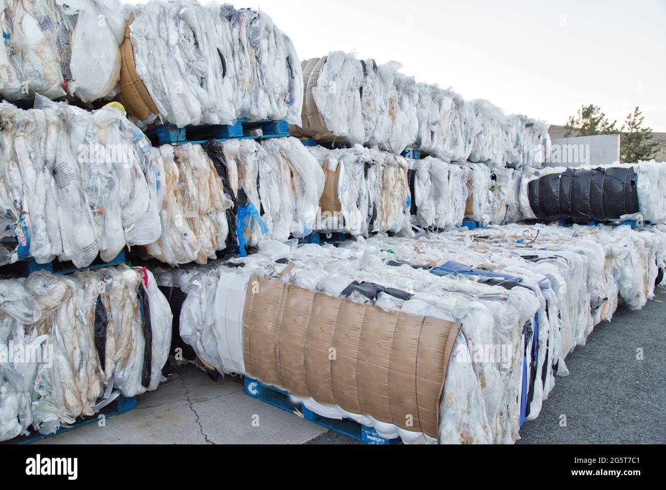 Compacted, baled plastics to be recycled. Stock Photo