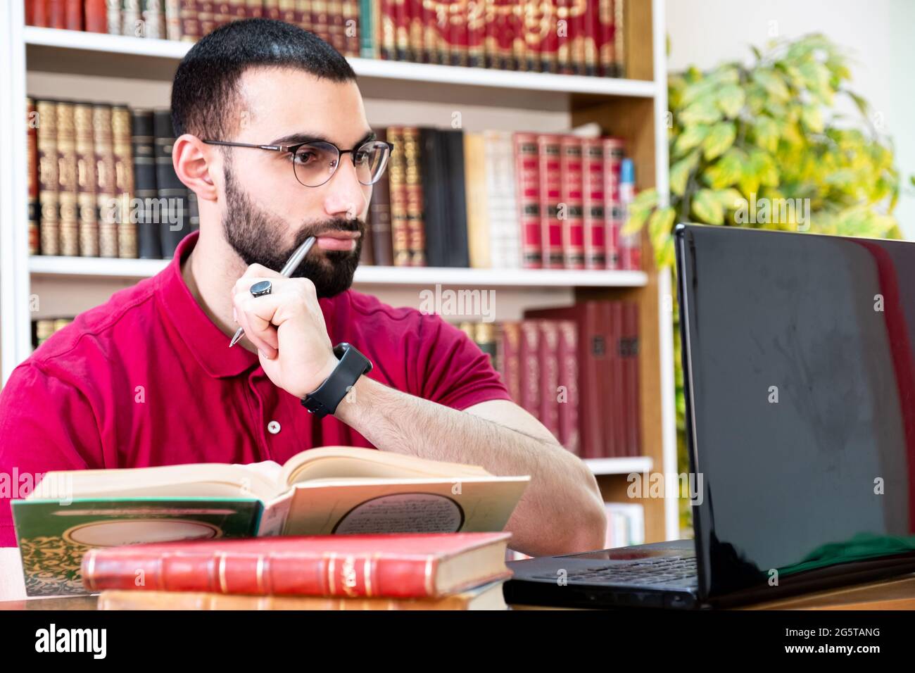 Arabic man using a laptop during conferences or meetings for studying ...